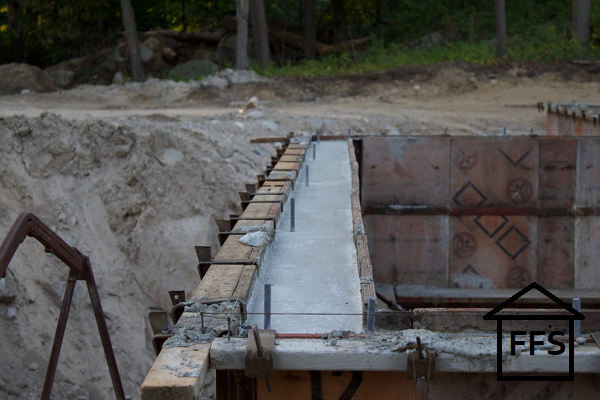 Preparing your foundation for your new home. Laying rebar, setting forms, pouring concrete. How to build your own house. General contract, save money. 